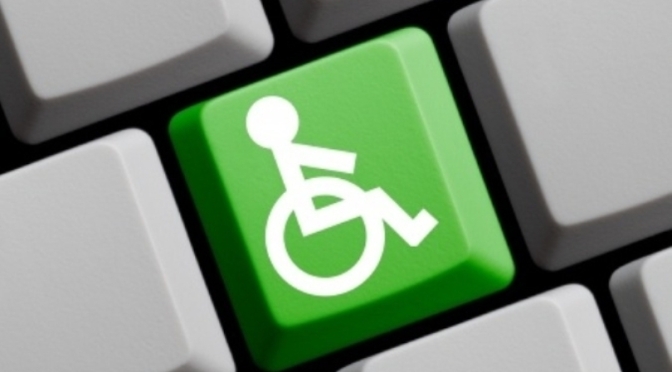 Green accessibility sign on keyboard